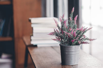 Close-up of flower pot on wooden table