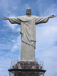 Low angle view of statue against sky