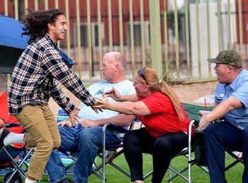 Friends sitting on a outdoors