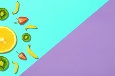 Digitally generated image of fruits on colored background