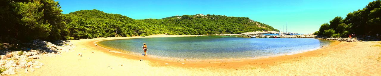 Scenic view of beach against clear sky