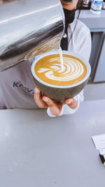 Woman holding coffee cup