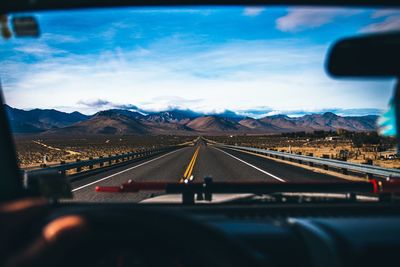 Highway seen through car windshield