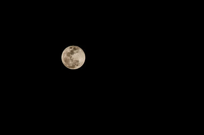 Low angle view of moon against sky at night