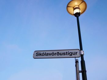 Low angle view of street light against sky