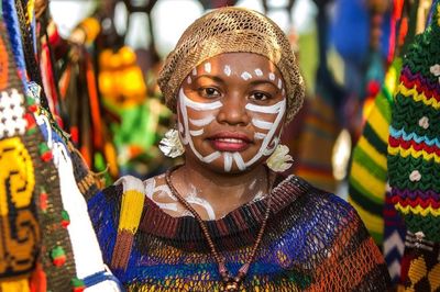 Portrait of woman with multi colored decoration