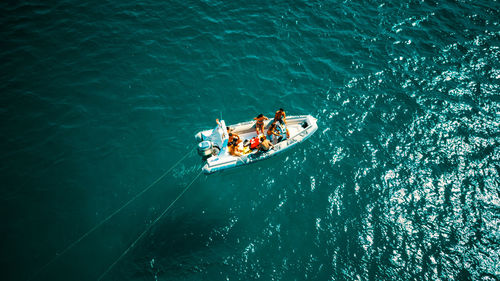 High angle view of people on boat sailing in sea