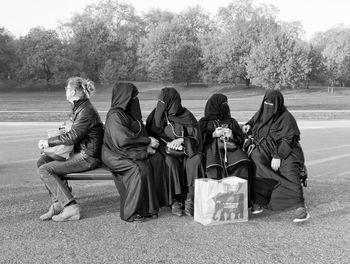 Group of people sitting outdoors