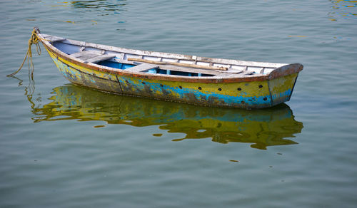 A beautiful image of single boat. boat on the lake. a single boat on the clear surface of the lake.