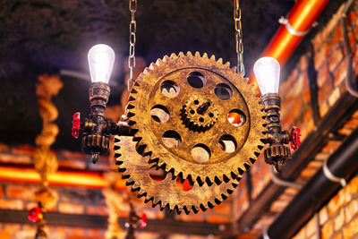 Low angle view of illuminated lanterns hanging in temple