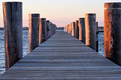 Pier over sea against clear sky