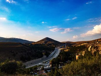 High angle view of road by mountain against sky