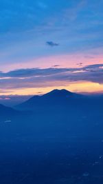 Scenic view of mountains against sky during sunset