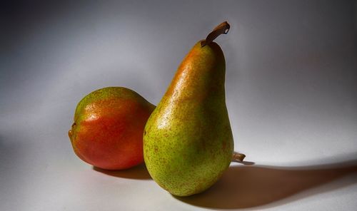 Close-up of fruit against white background