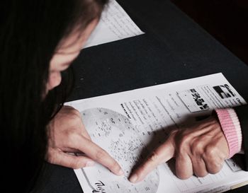 High angle view of woman reading book