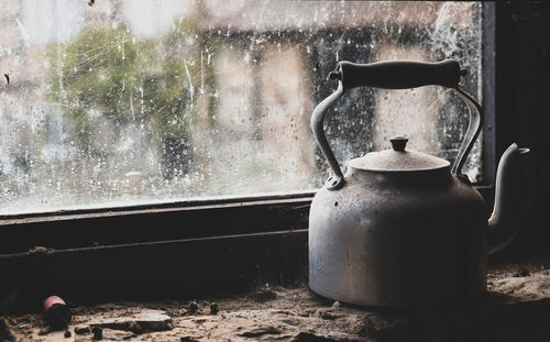 Vintage kettle on stone wall