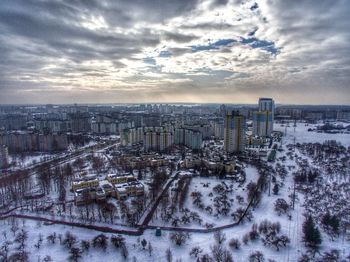 High angle view of buildings against sky during winter