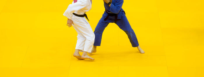 Low section of people practicing judo