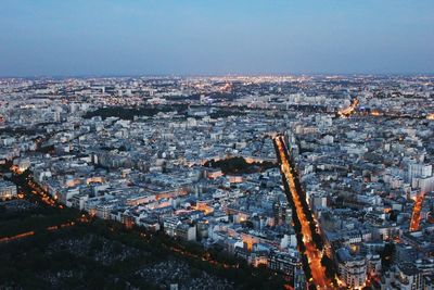 High angle view of illuminated cityscape against sky