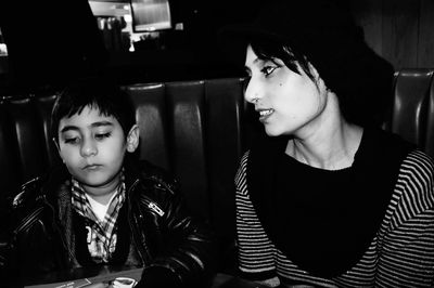 Mother looking at son in restaurant