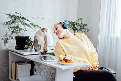 Mental health and work. work life balance. young woman in headphones near laptop at home office