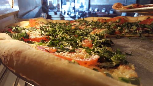 Close-up of served veg pizza in restaurant 