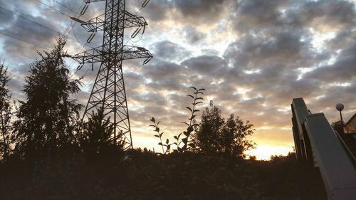 Low angle view of silhouette trees against sky during sunset