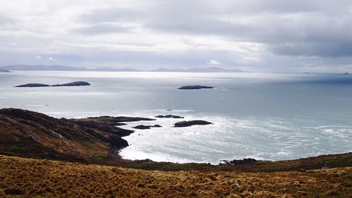 Scenic view of sea against cloudy sky