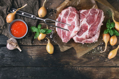 Meat and ingredients on table