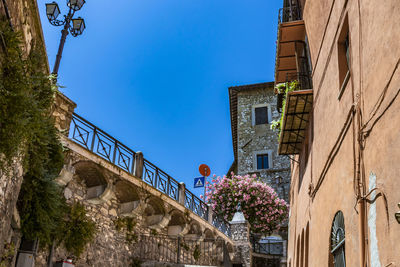 Low angle view of buildings against blue sky