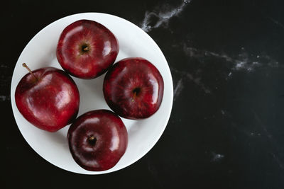 High angle view of apples in bowl on table