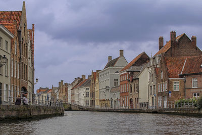 Buildings in town against sky