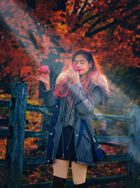 Portrait of young woman in the fall season