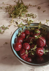 High angle view of strawberries in bowl on table