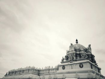 Low angle view of statue against cloudy sky