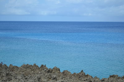 Scenic view of sea against blue sky