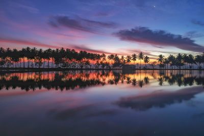 Scenic view of lake against sky during sunset