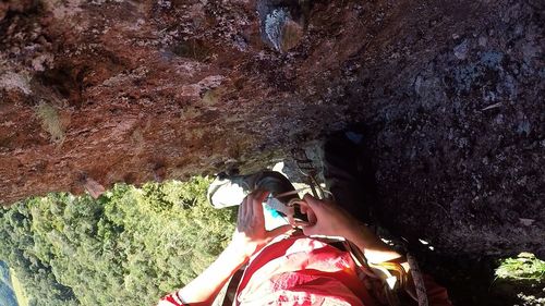 Low angle view of child on rock formation