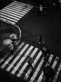 High angle view of woman walking on road