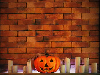 View of pumpkin on brick wall