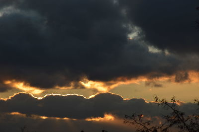 Low angle view of dramatic sky during sunset