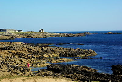 Scenic view of sea against clear blue sky