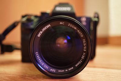 Close-up of camera on table