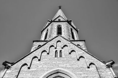 Low angle view of bell tower against sky