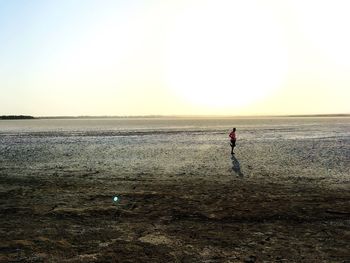 Scenic view of sea against clear sky during sunset