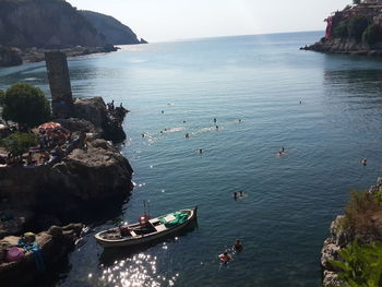 High angle view of rocks on sea against sky