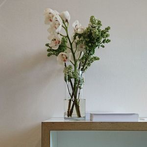 Close-up of white flower vase on table at home
