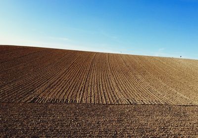 View of landscape against clear blue sky