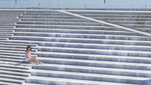 Woman sitting on steps