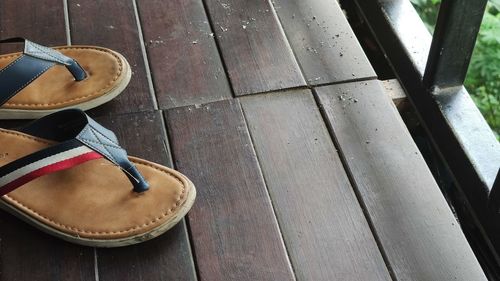 High angle view of shoes on wooden floor